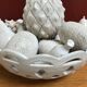 Trompe l'oeil fruit cut in white earthenware by Jean Roger, circa 1960.