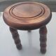 Small vintage tripod stool made of turned wood, in the style of Charles.