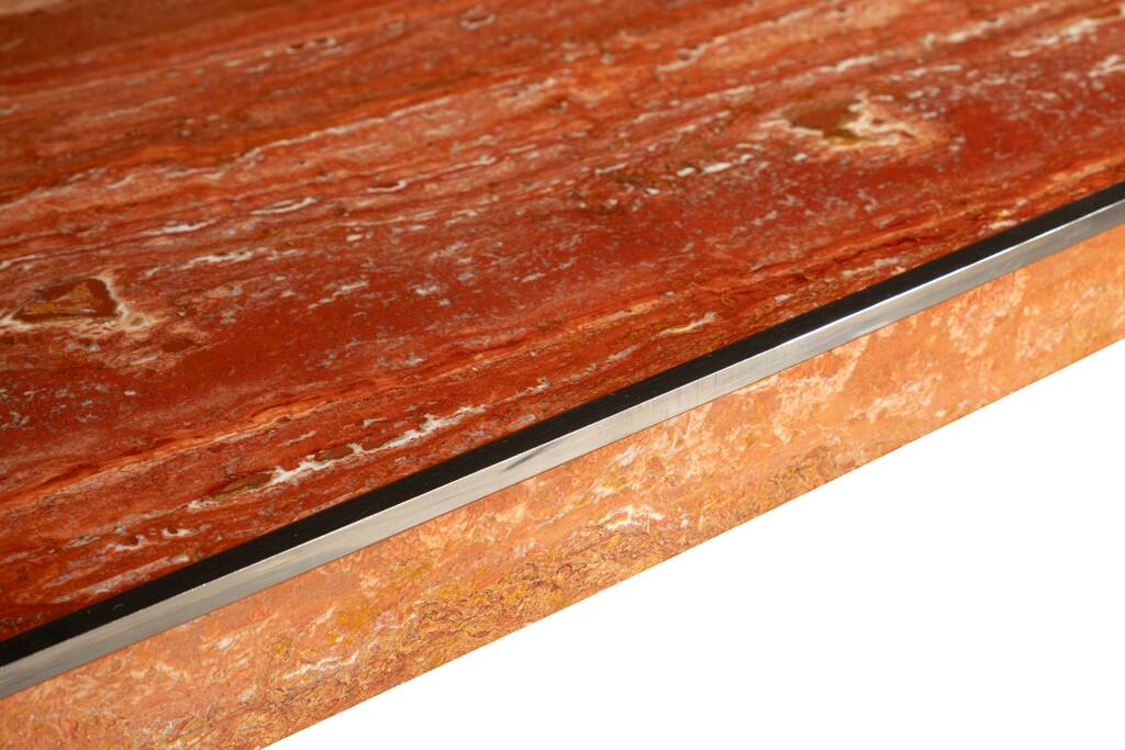 Willy Rizzo. Large table in orange-red travertine. 1970s.