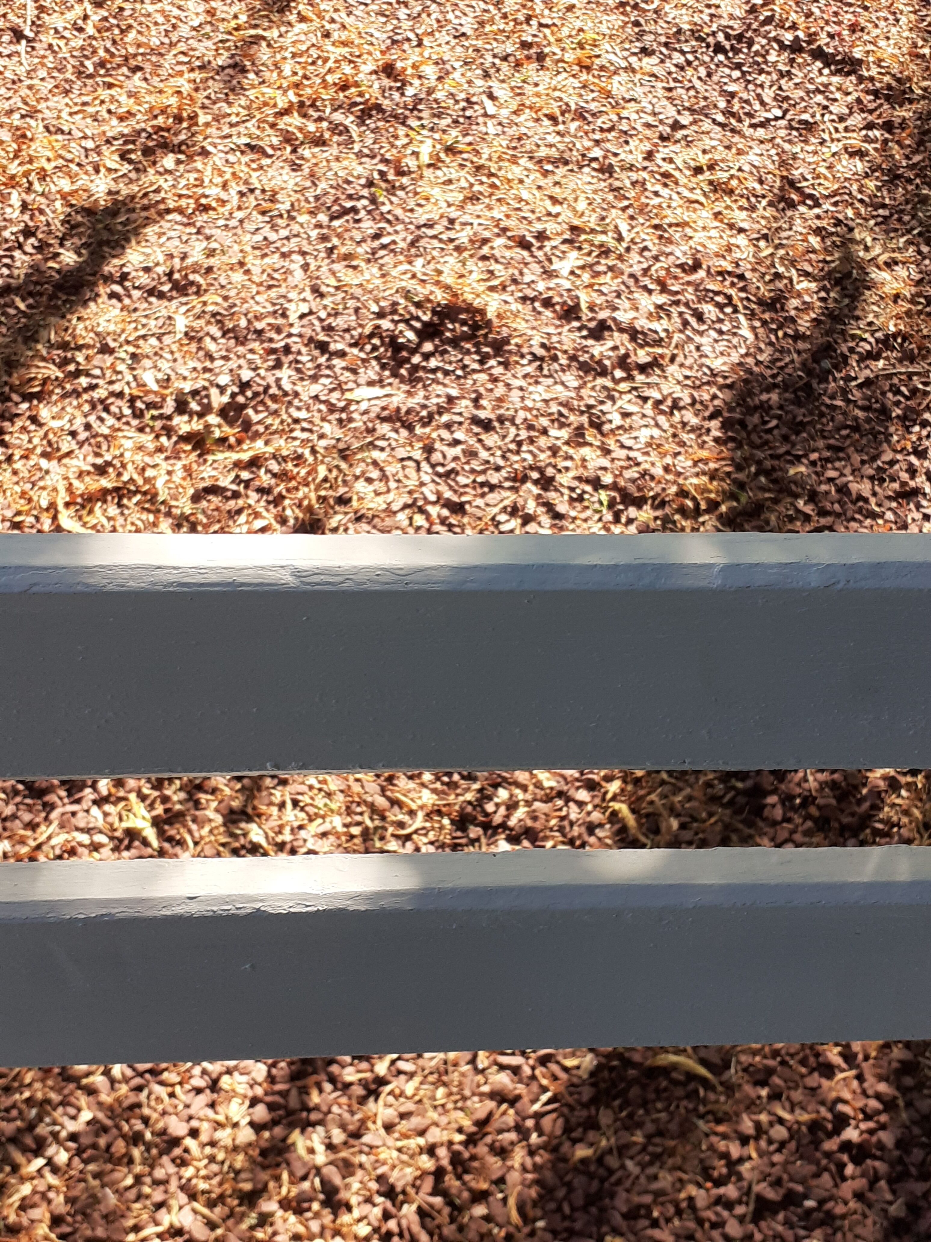 Old garden bench with cast iron feet and wooden planks