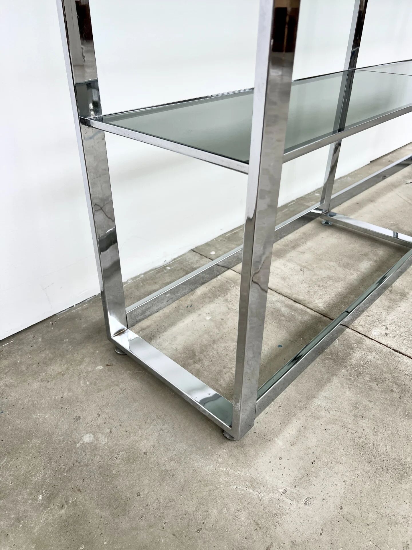 Chrome bookshelf with smoked glass — Italy, 1970s