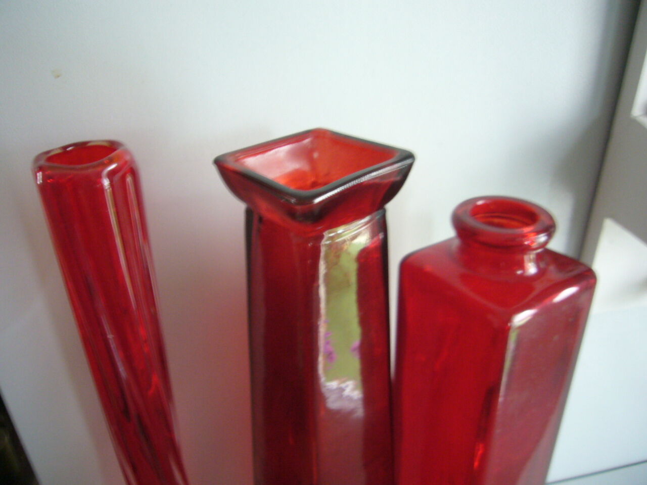 Set of three red bottles