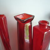 Set of three red bottles