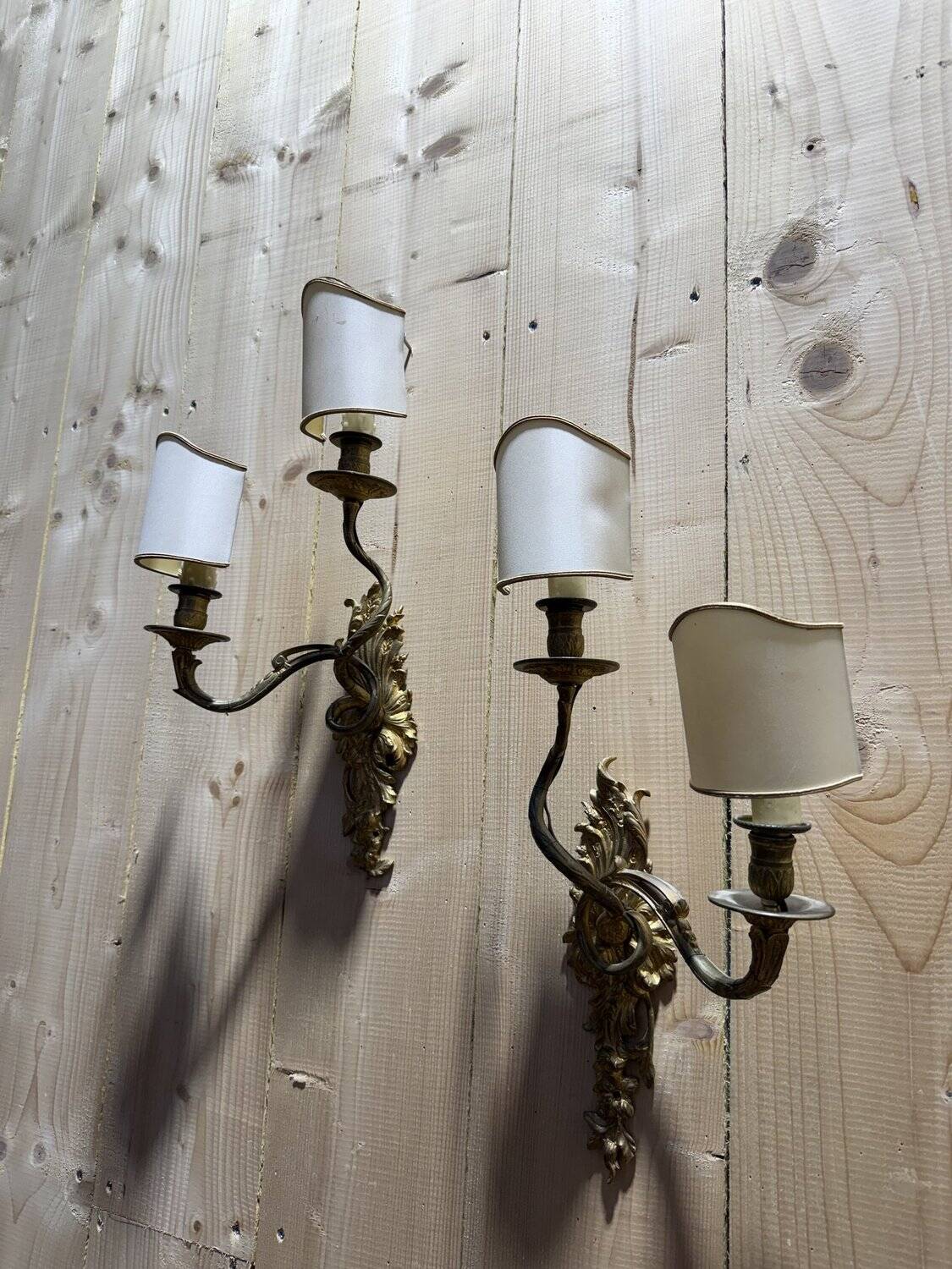 Pair of Louis XV style Rocaille wall sconces in bronze