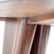 Dining table with a wooden frame and tinted glass top.