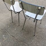 2 beige formica and steel chairs