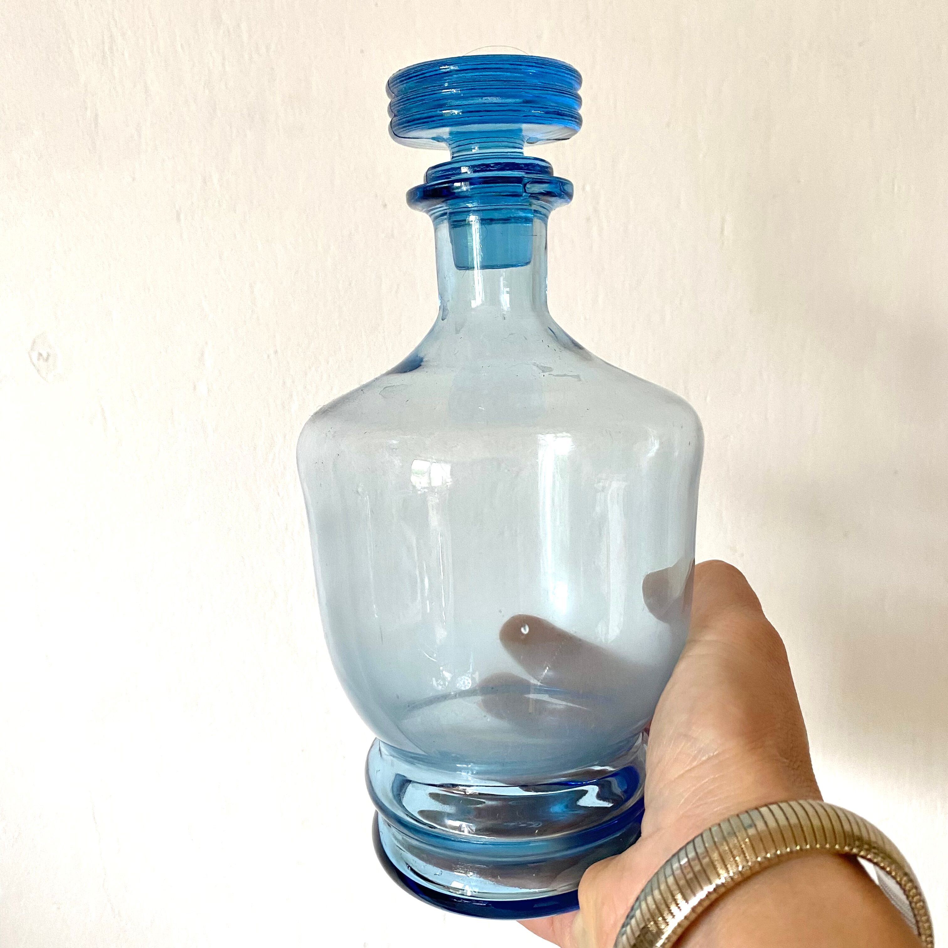 Antique carafe in blue glass