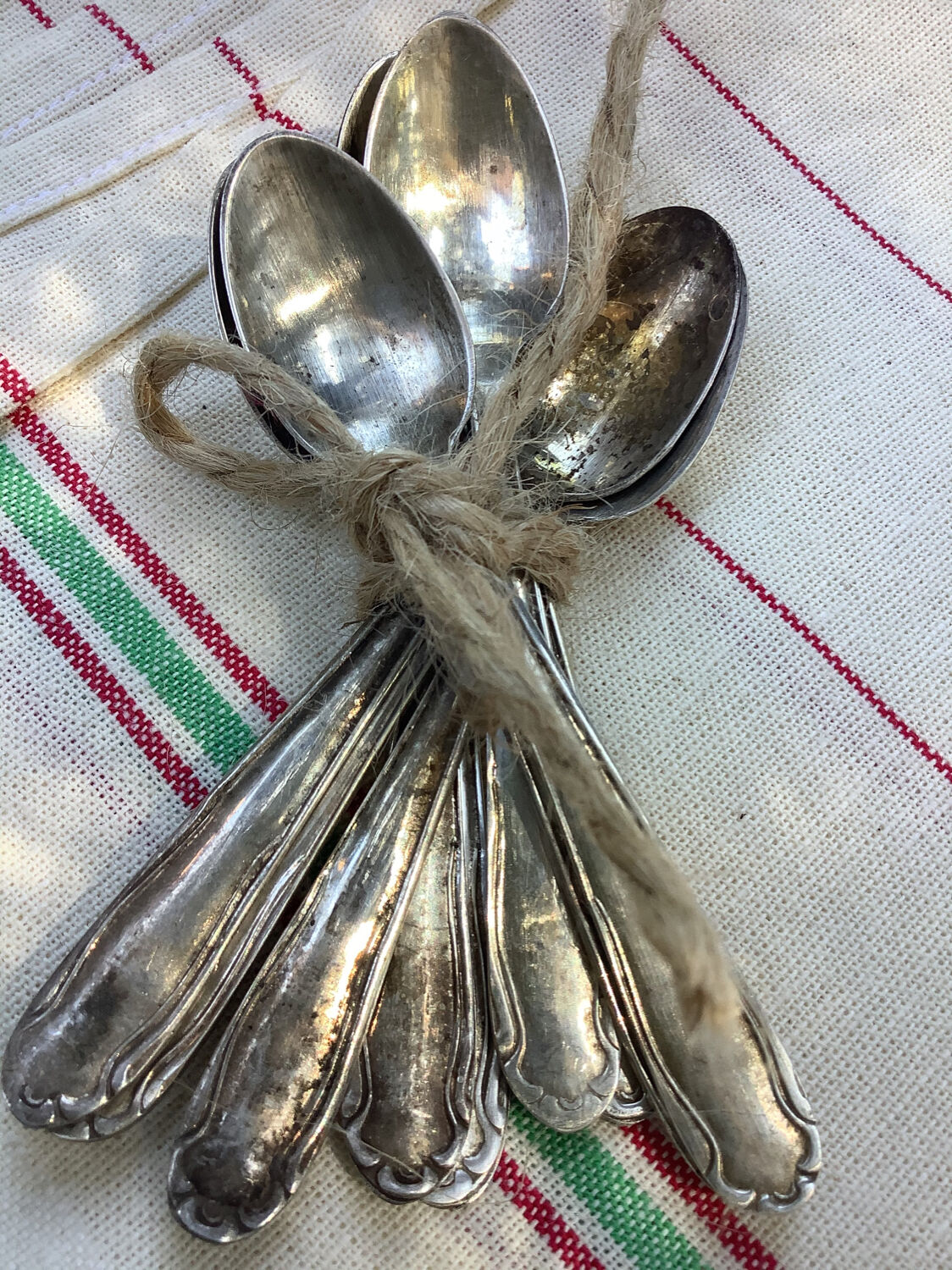 Nine small silver teaspoons