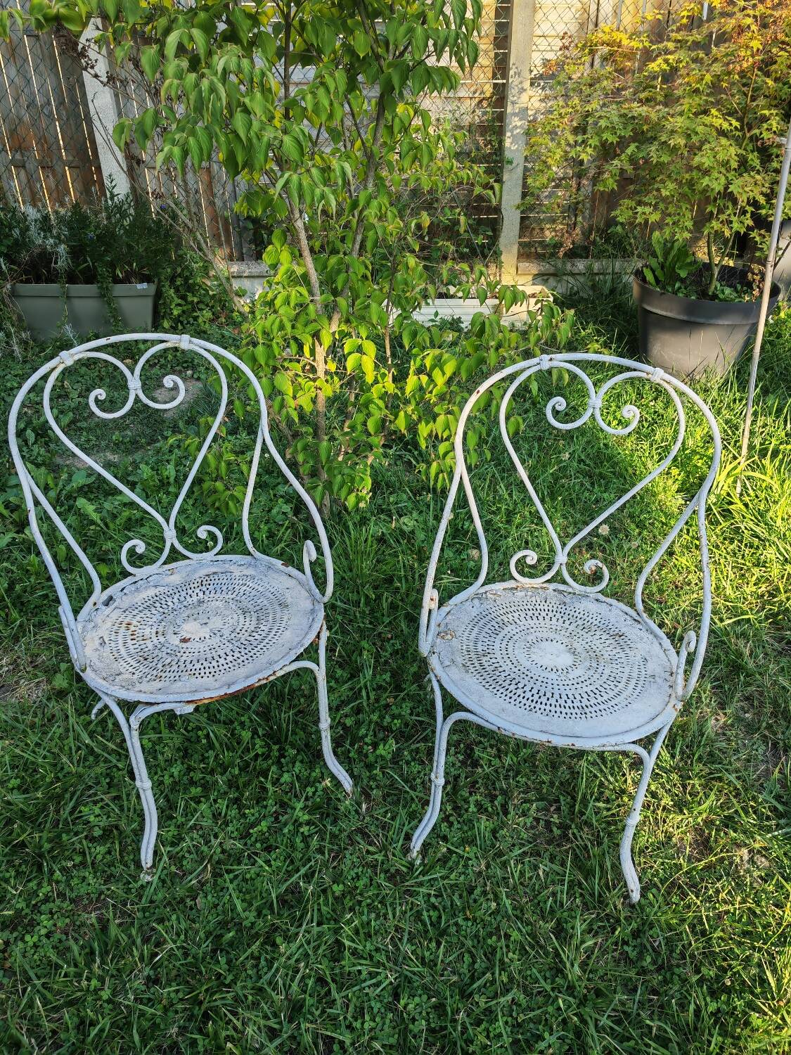 2 antique wrought iron armchairs