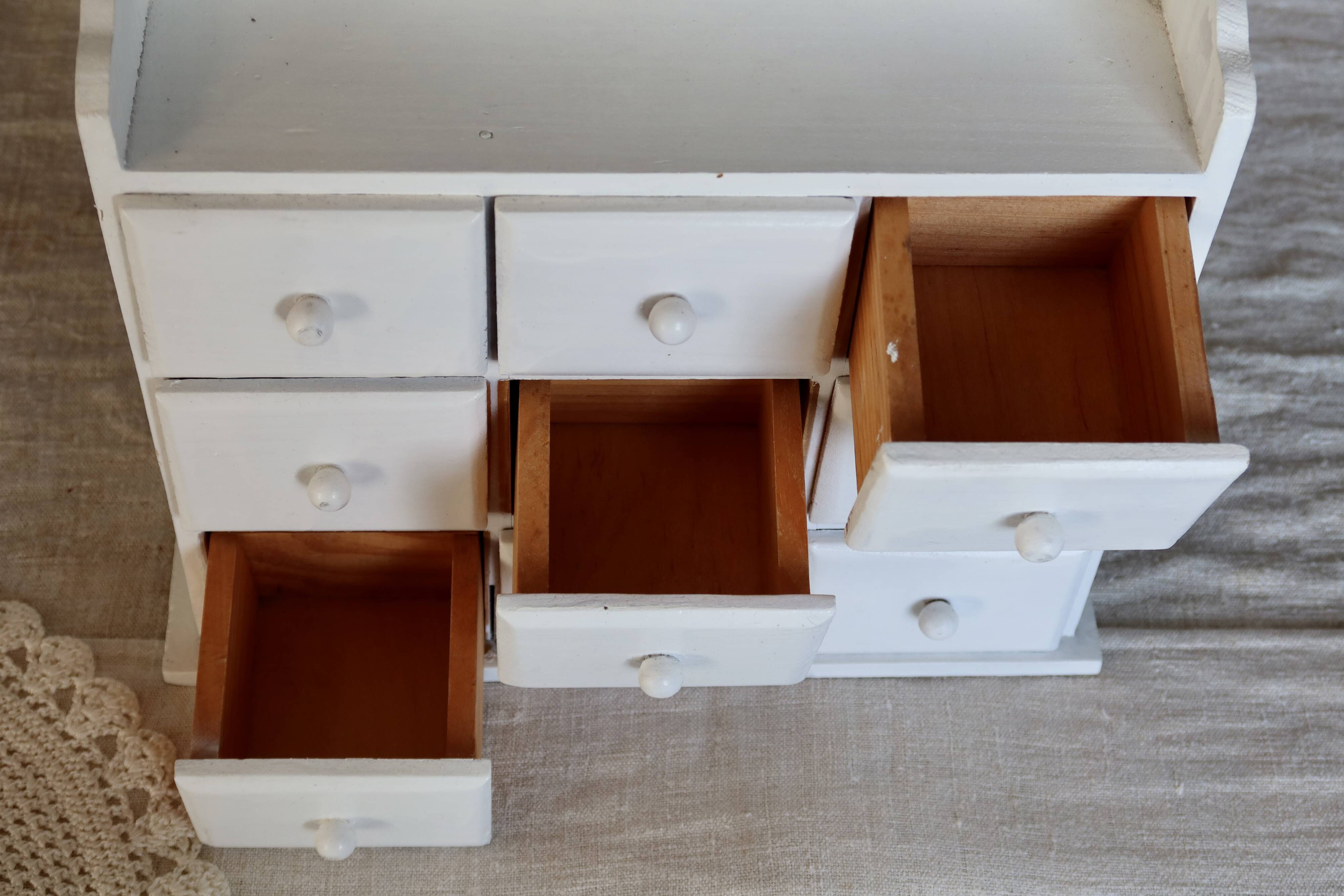 Vintage wall shelf in white wood (pine) with 9 drawers