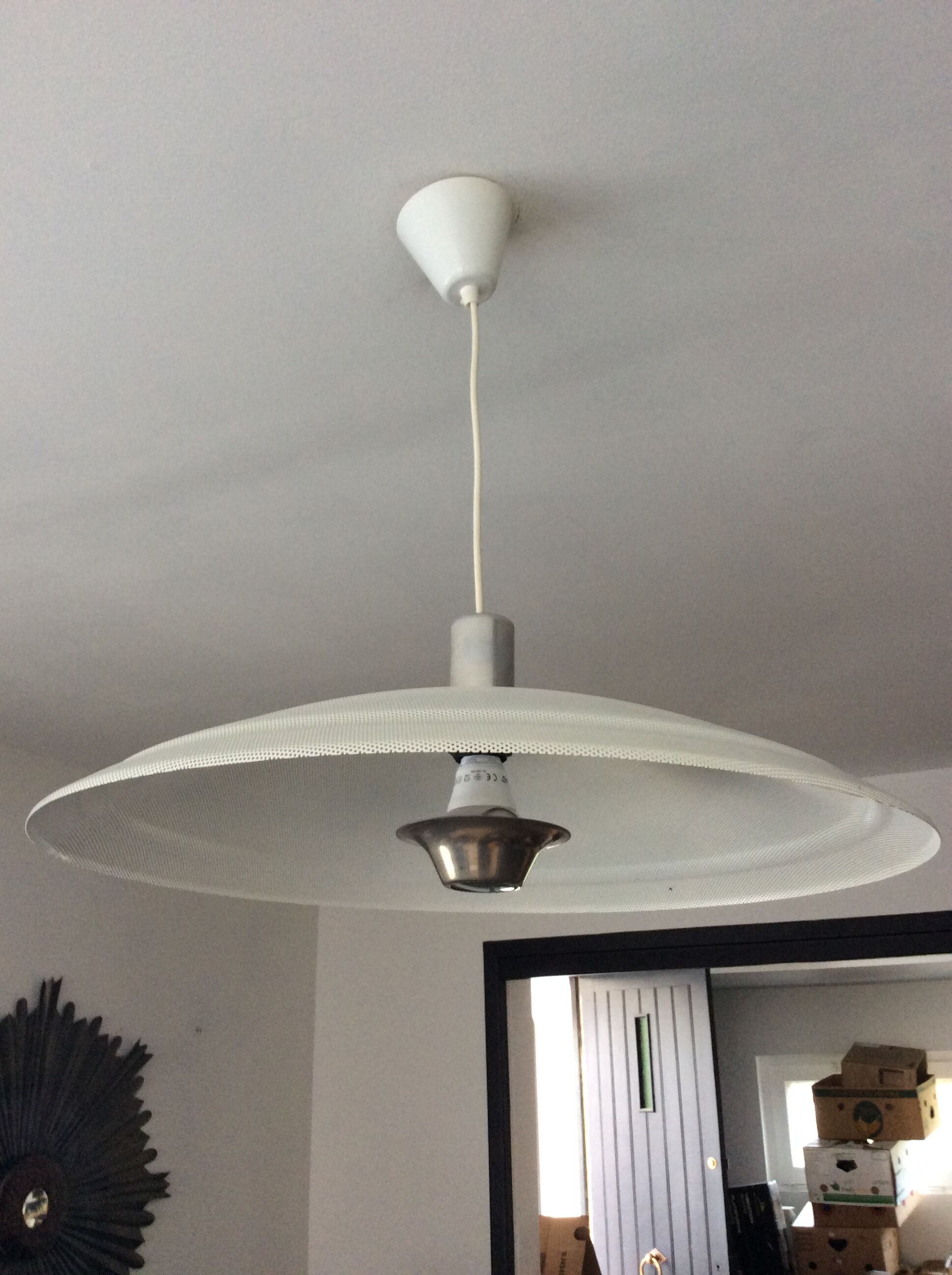 Suspension of the 70s in perforated metal