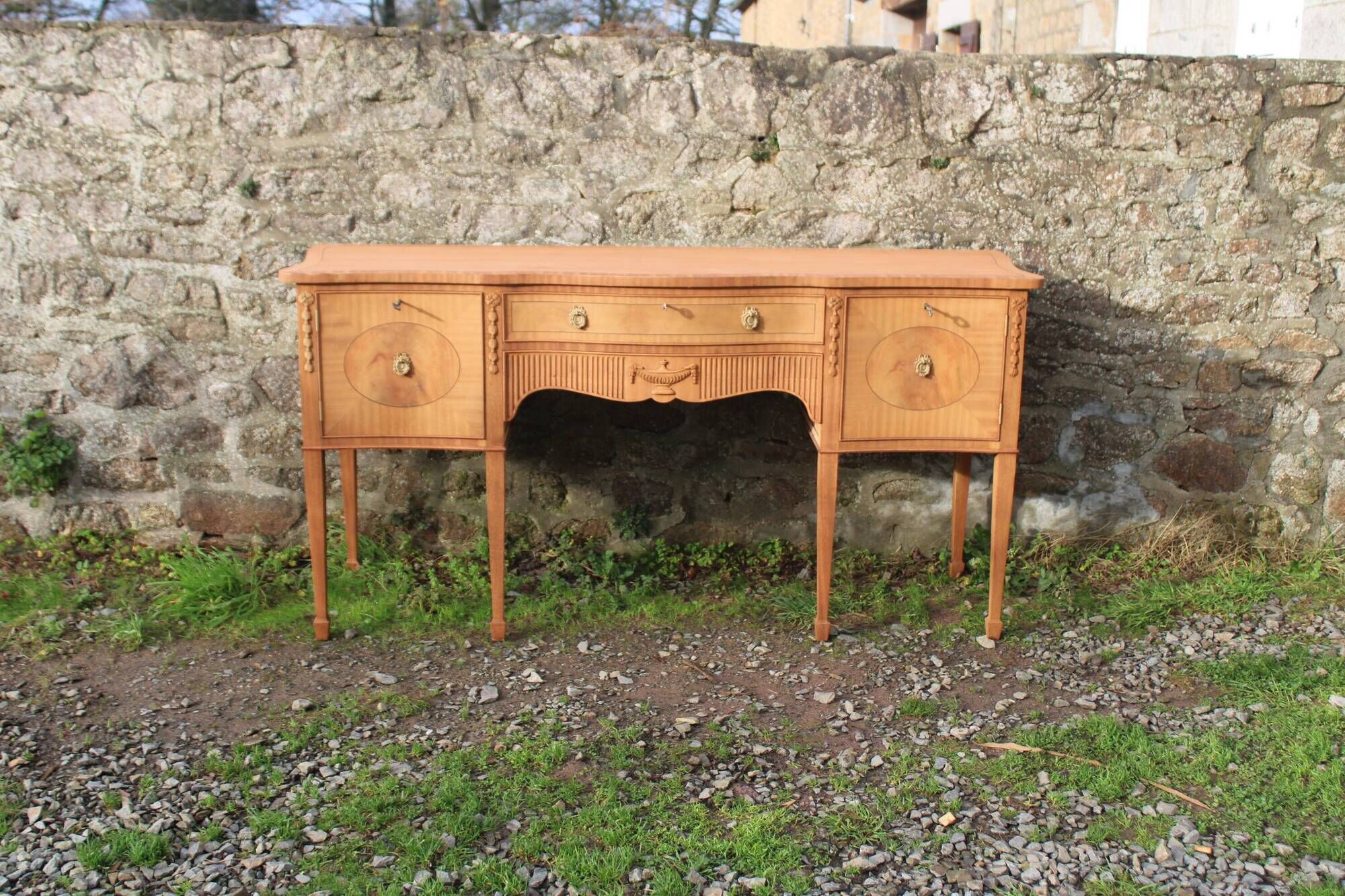 English-made enfilade in Louis XVI style with light wood veneers.