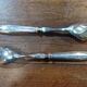 Silver-plated salad cutlery in their case.