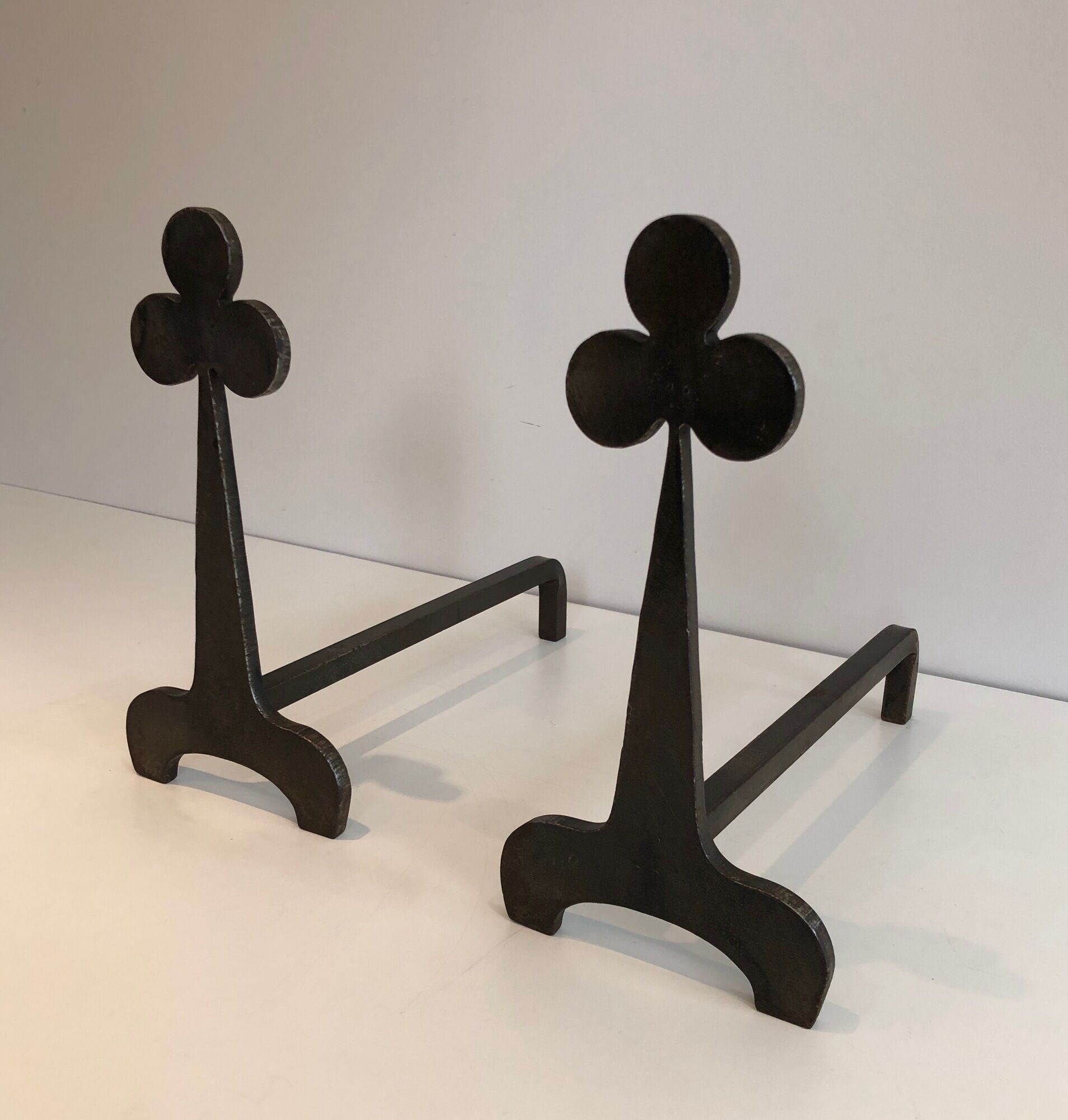 Pair of wrought steel and iron chenets with clover decorations 1950
