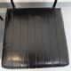 Set of 2 vintage modernist armchairs in black faux leather and metal.