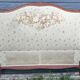 antique fabric and wood headboard
