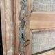 Large antique wardrobe made of wood and burlap.