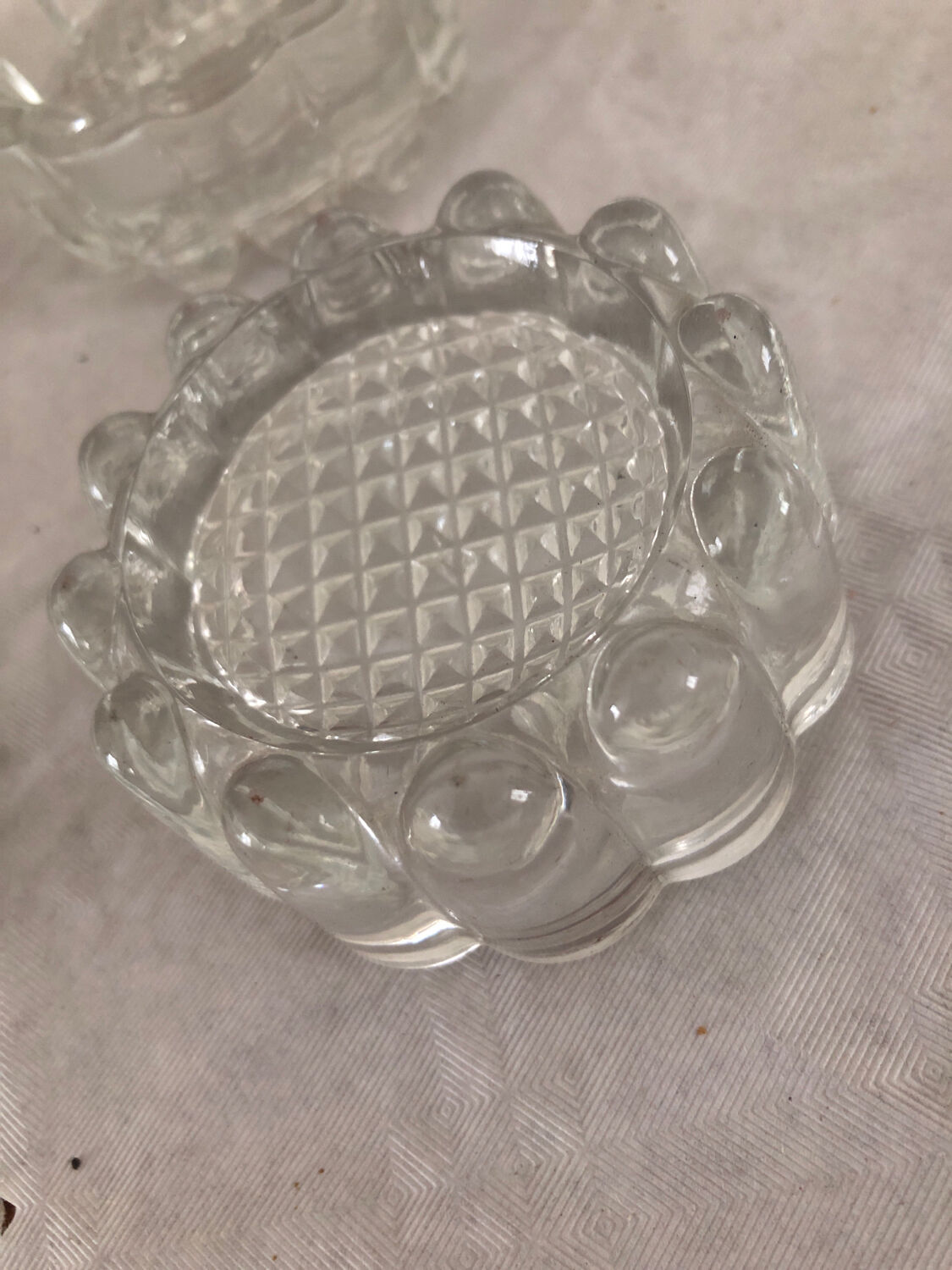 4 flat glass candle holders cut in the shape of Vintage flowers