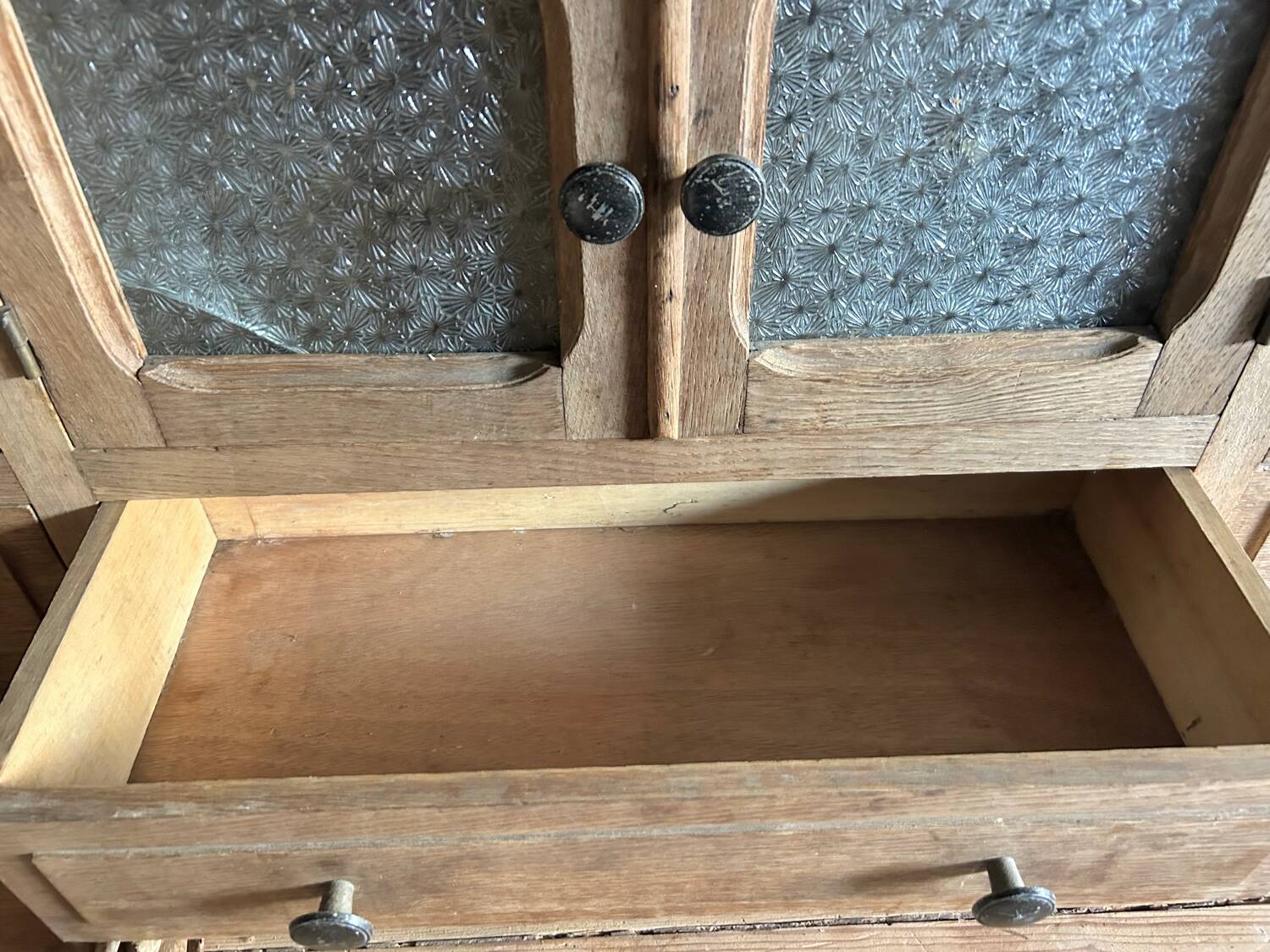 Small piece of furniture with glass doors and drawers