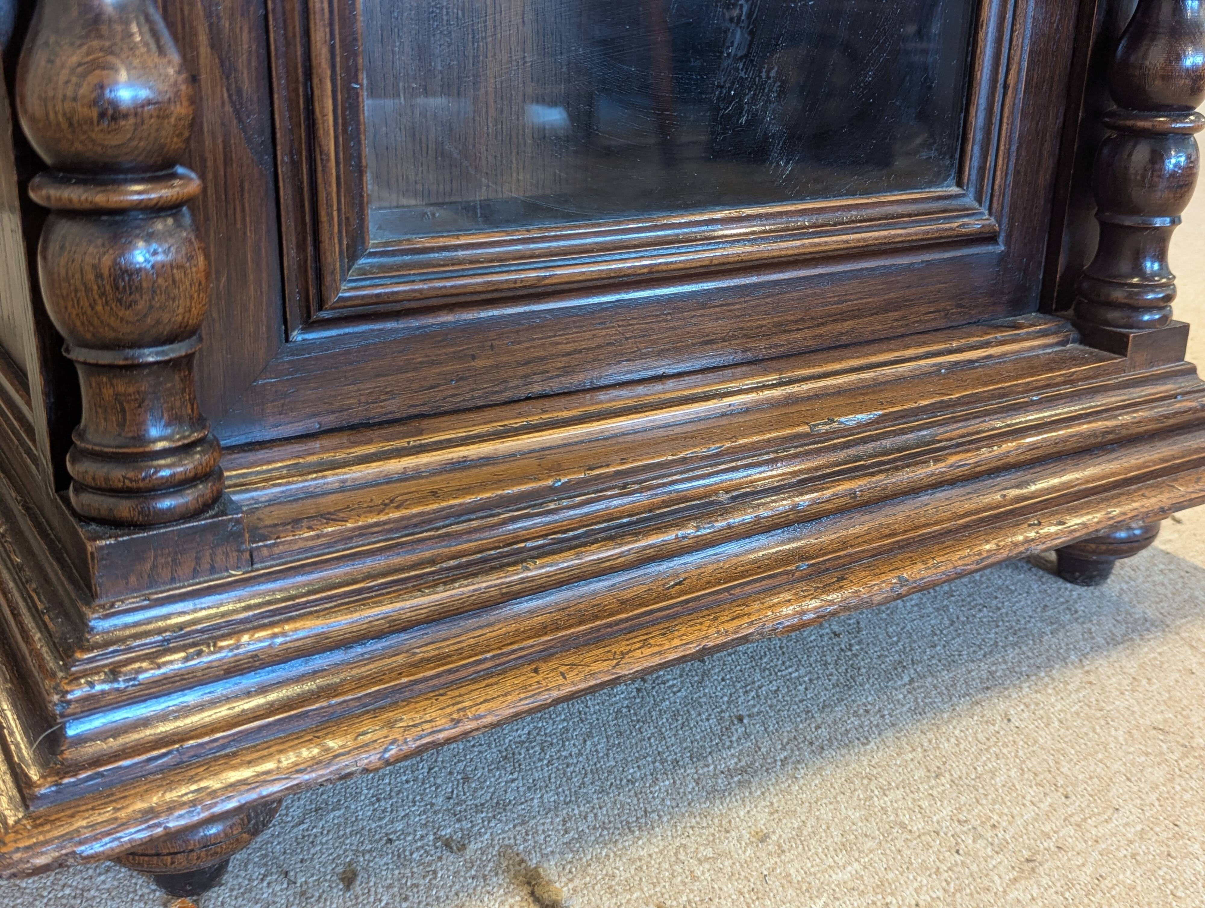Two-body display cabinet in oak, Henri II style.