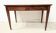 Louis XVI style desk in mahogany and veneer, 20th century.