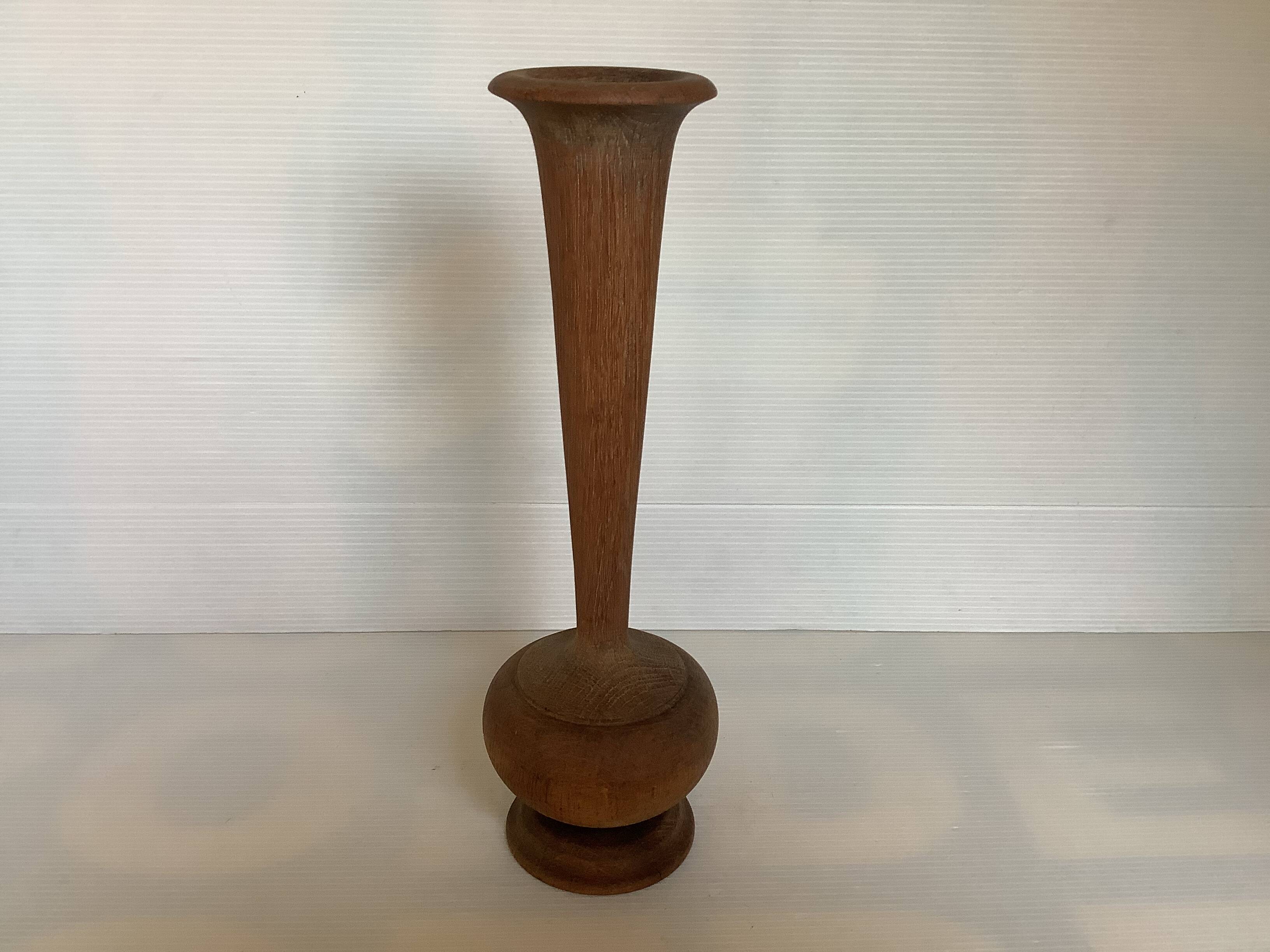 Old trumpet-shaped wooden vase