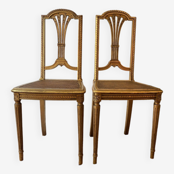 Paire de chaises dorées cannelées style Louis XVI