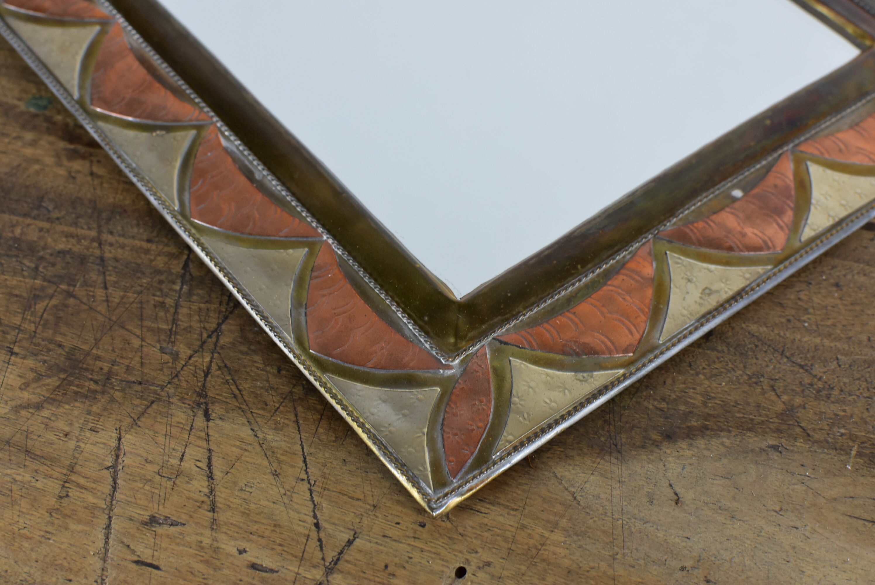 Decorated brass mirror.