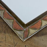 Decorated brass mirror.