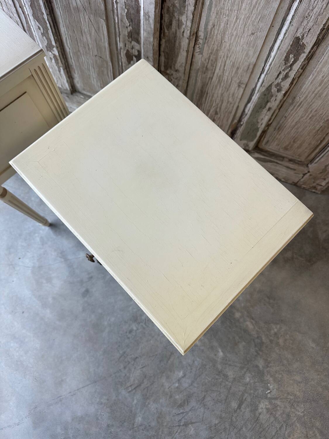 Pair of Louis XVI style bedside tables in white lacquered wood