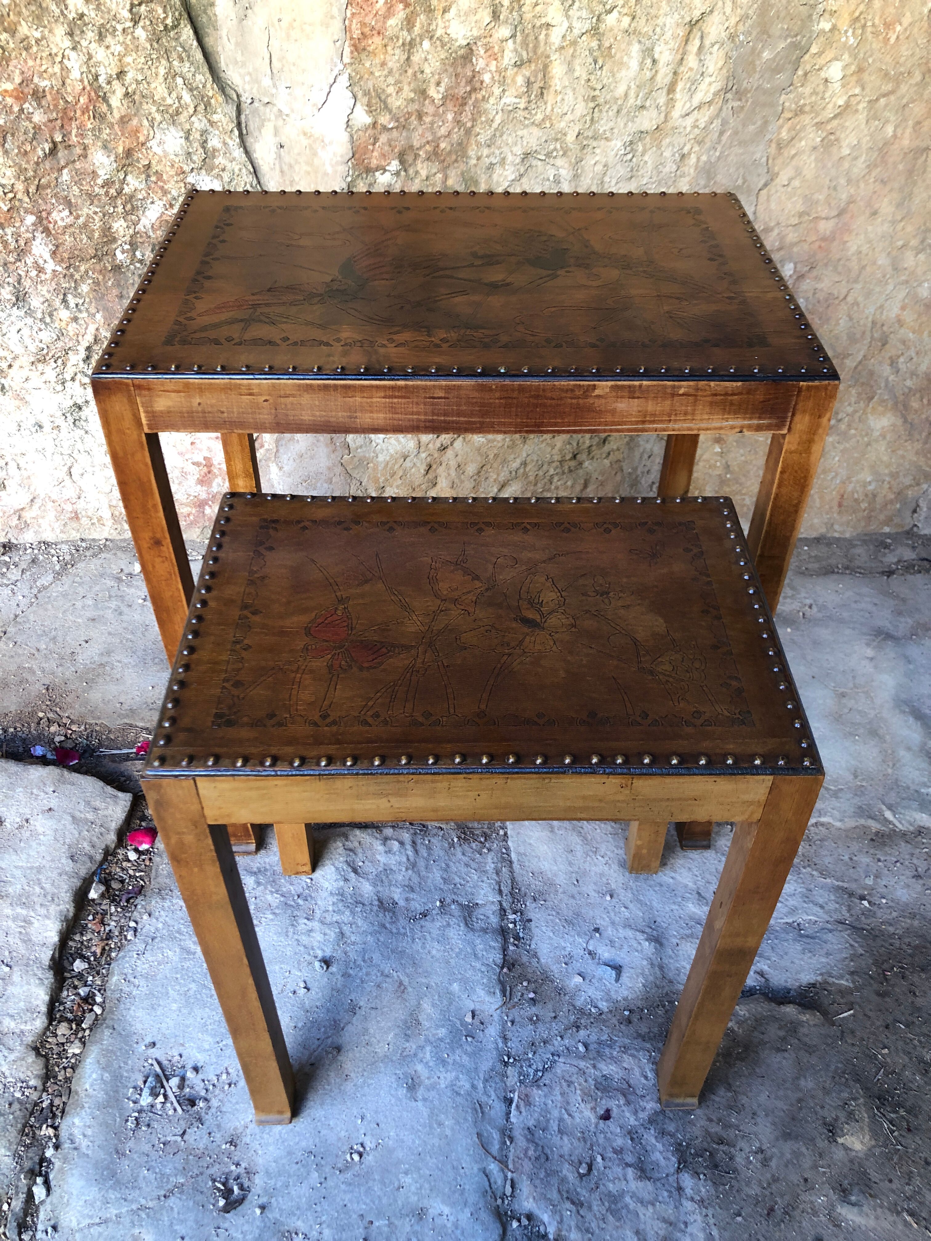 Pair of studded nesting tables from the 1930s.