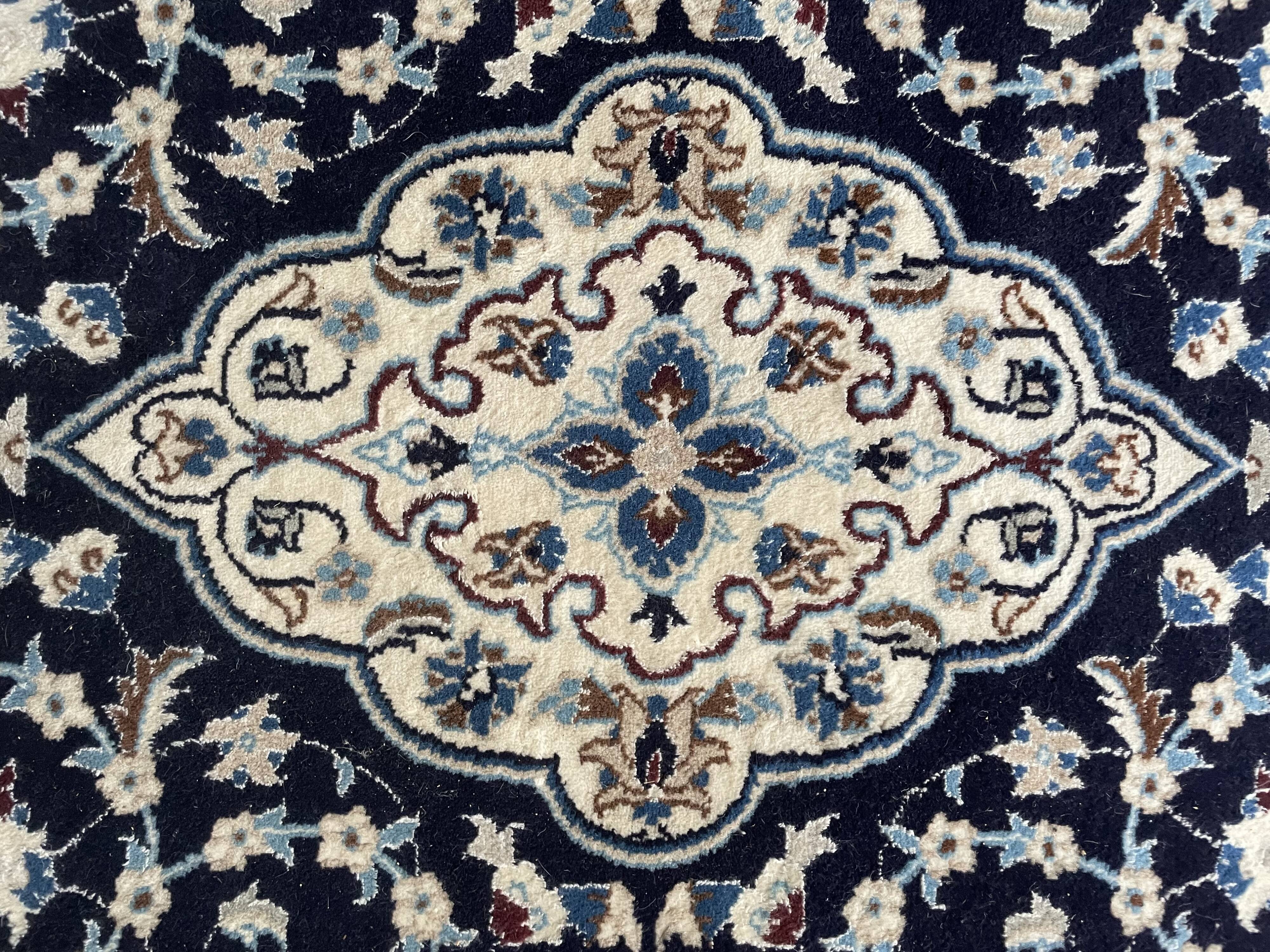 Hand-knotted Nain Persian rug with blue and white floral design