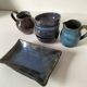 Set of artisanal ceramics in shades of blue.