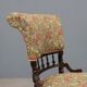 Victorian armchair with fabric pouf, England, 19th century.