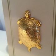 Pair of lamps decorated with golden turtles