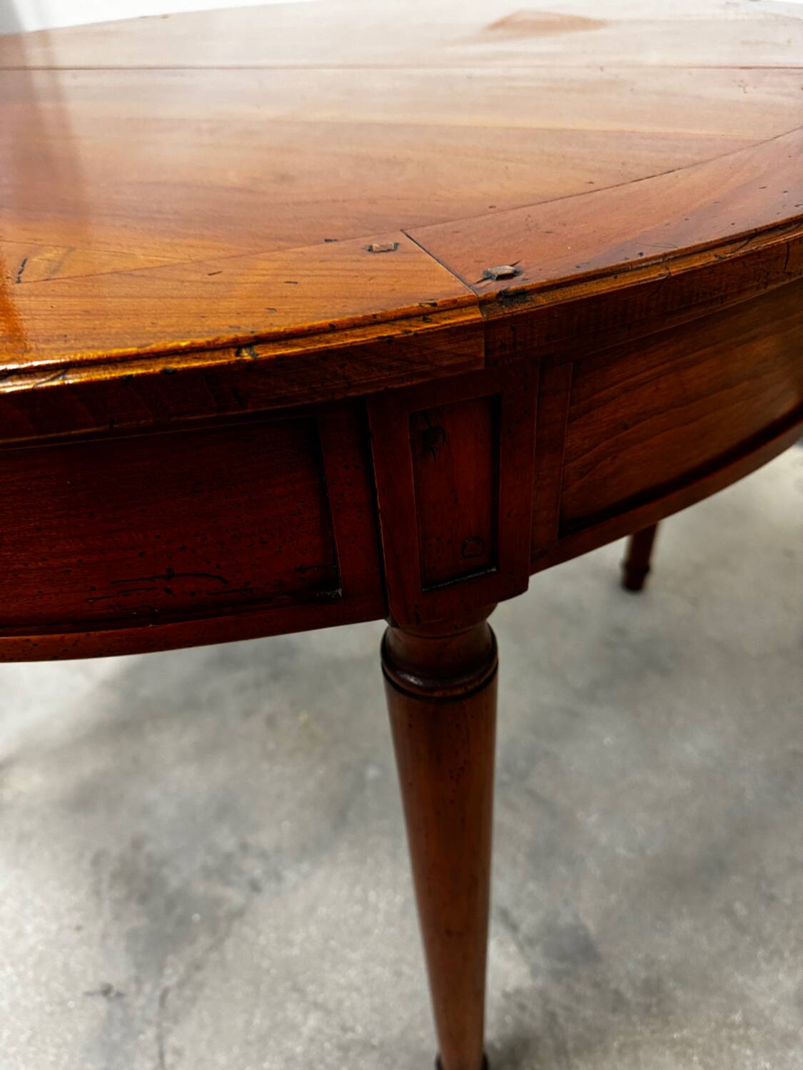 Round cherry wood table in Louis XVI style