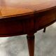 Round cherry wood table in Louis XVI style