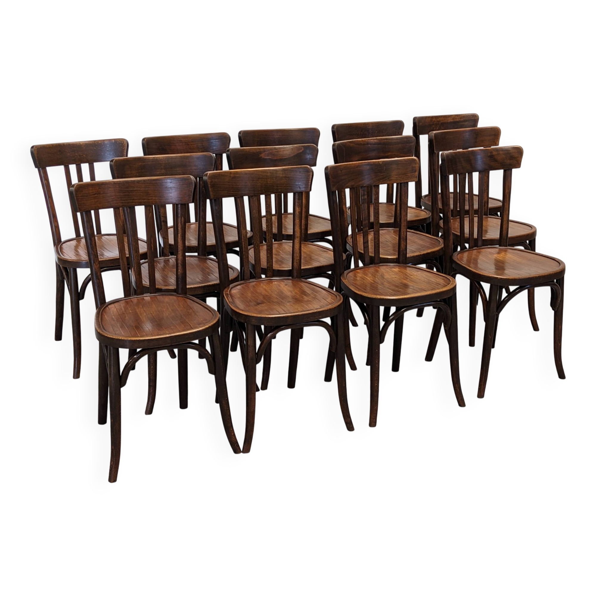 Set of 13 Baumann bistro chairs in bent beech, France circa 1930.