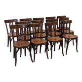Set of 13 Baumann bistro chairs in bent beech, France circa 1930.