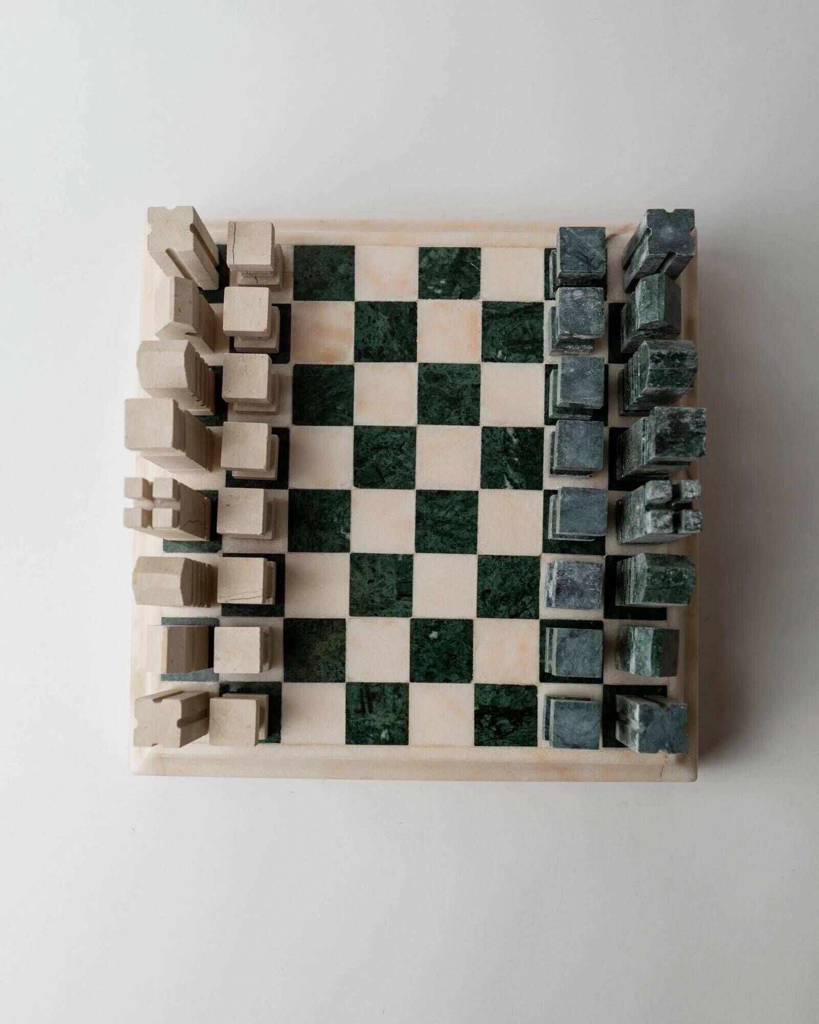 Vintage marble chess set from the 1970s, green and beige stone board, heavy design, geometric pieces, sculptural tabletop game, gift idea.