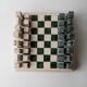 Vintage marble chess set from the 1970s, green and beige stone board, heavy design, geometric pieces, sculptural tabletop game, gift idea.