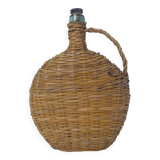 old bottle dressed in rattan vintage pilgrim gourd