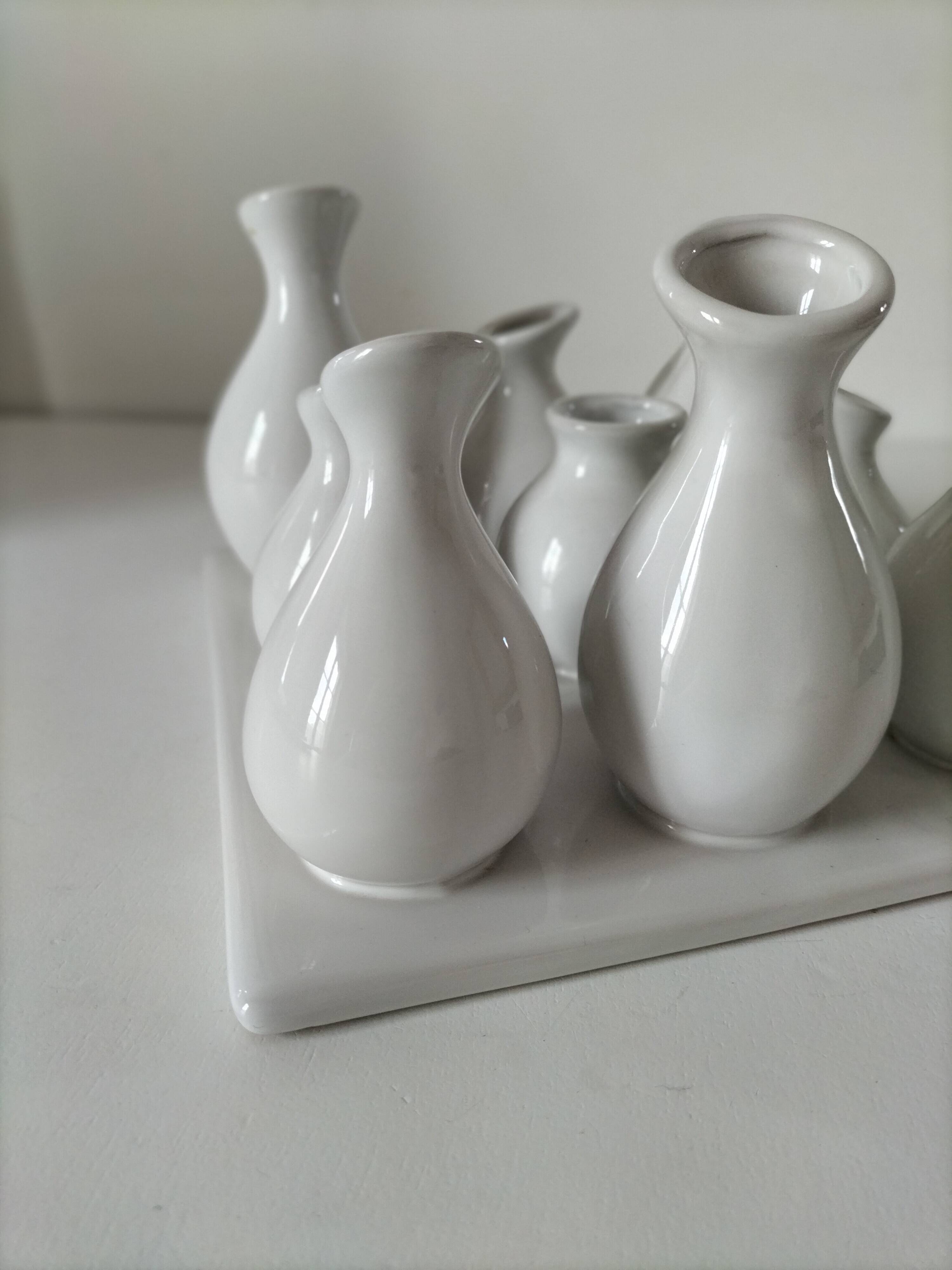 Multiple vintage white soliflore – centrepiece with 9 ceramic vases