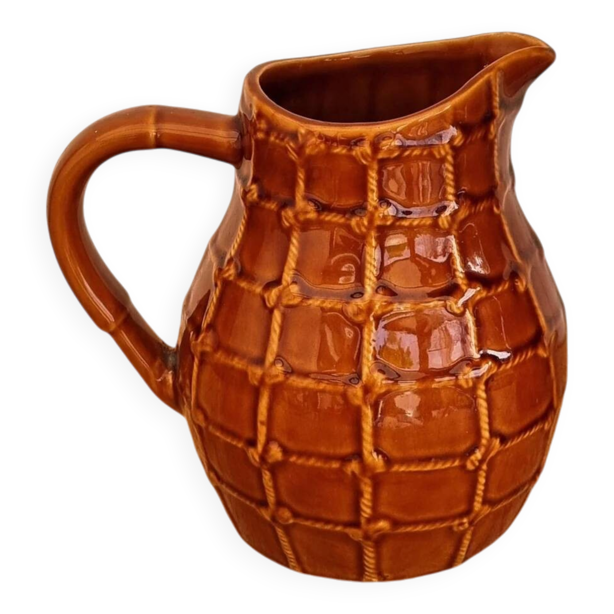 Vintage Saint Clément pitcher with a caramel checkered design.