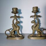 Pair of bronze hand candlesticks decorated with chimeras 19th century