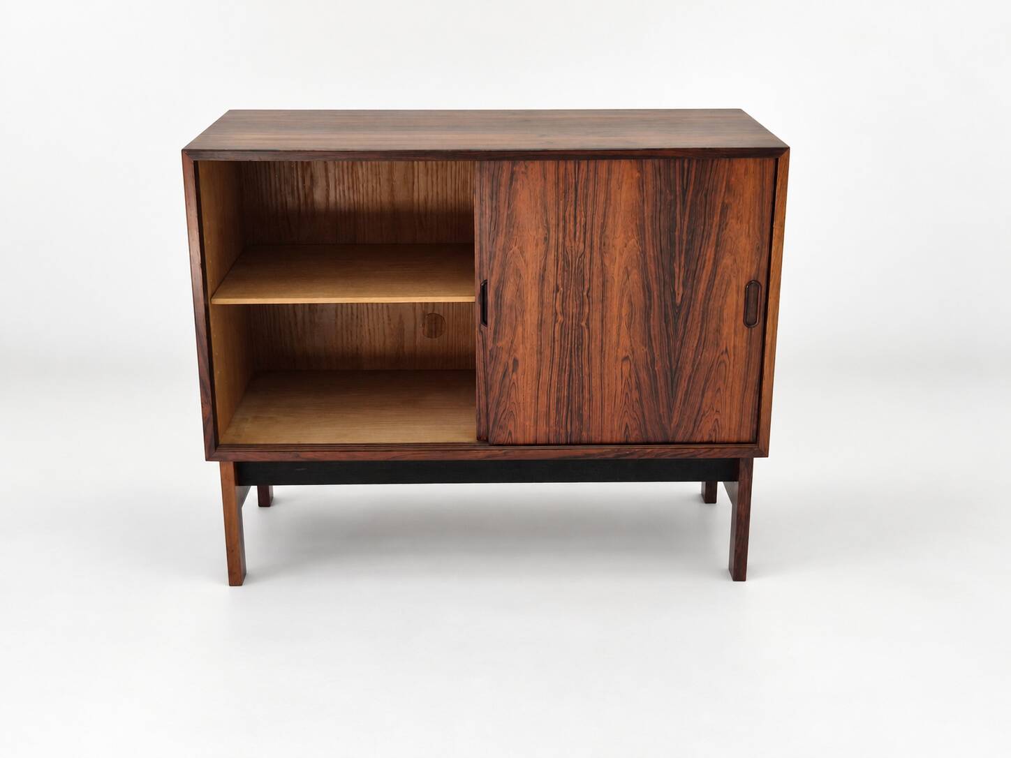 Low sideboard in rosewood with sliding doors. Denmark, 1960s