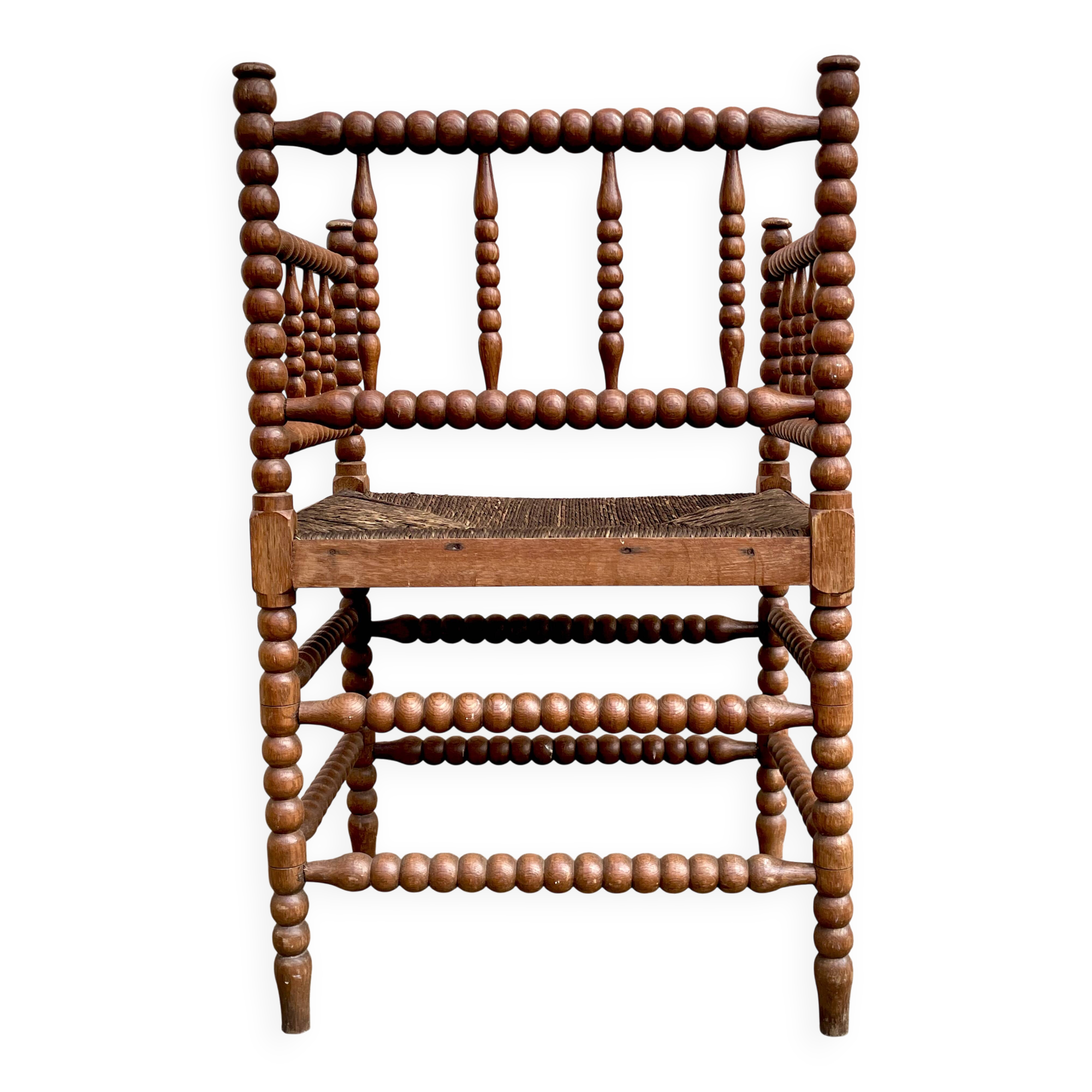Antique Bobbin armchair with straw seat