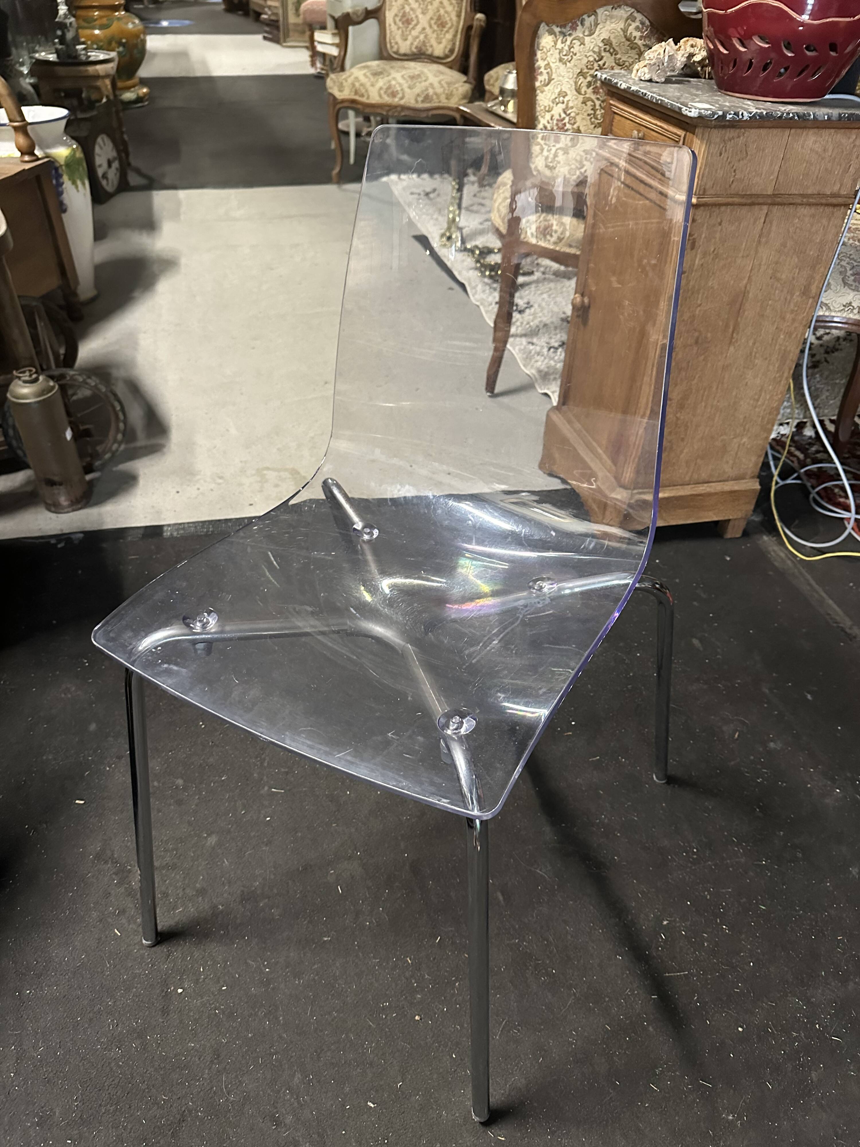 Pair of smoked polycarbonate chairs
