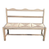 Wooden bench with vintage straw seating