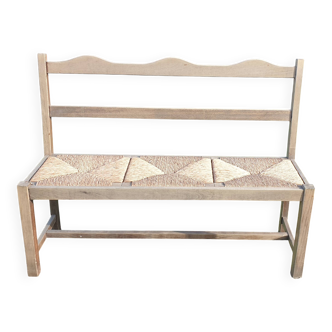 Wooden bench with vintage straw seating
